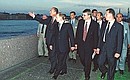President Vladimir Putin and French President Jacques Chirac taking a walk along the Neva River.