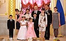 Presenting the Order of Parental Glory to Gulnara and Anatoly Bely, who are raising 8 children.