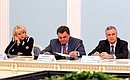 Public Health and Social Development Minister Tatyana Golikova and Presidential Aides Konstantin Chuychenko and Alexander Abramov at a State Council Presidium meeting on increasing state guarantees of consumer rights protection.