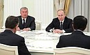 Meeting with business representatives. With Rosneft CEO and Chairman of the Management Board Igor Sechin (left).