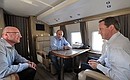 С Премьер-министром Великобритании Дэвидом Кэмероном (справа) и президентом Оргкомитета «Сочи-2014» Дмитрием Чернышенко во время осмотра с вертолёта олимпийских объектов Сочи.