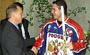 President Vladimir Putin with Russian ice hockey team captain Pavel Bure at the Russian-Czech Spartak Cup match.