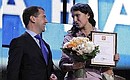At youth forum The Future is Ours. Dmitry Medvedev presents a Presidential letter of gratitude “For pro-active attitude and public work for the benefit of Russia” to Yulia Zagitova.