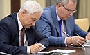At a meeting on budget planning for 2016. Presidential Aide Andrei Belousov (left) and deputy prime minister Dmitry Rogozin.