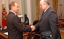 President Vladimir Putin meeting with Prime Minister Mikhail Fradkov.