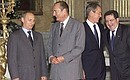 G8 delegates making entries in the distinguished visitors\' “Golden Book” of Genoa. President Vladimir Putin with French President Jacques Chirac, U.S. President George W. Bush and Chairman of the European Commission Romano Prodi, right, ahead of the ceremony.