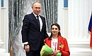 Presenting state decorations to winners of the 2020 Summer Paralympic Games in Tokyo. Margarita Sidorenko, archery champion of the Paralympics, receives the Order of Friendship. Photo: RIA Novosti