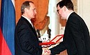 A ceremony of presenting the 1999 State Prizes in science and technology. Kirill Konstantinov, PhD in Medical Science and doctor at the Filatov State Clinic, received a golden plaque and prize winner diploma.