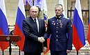 At the ceremony for presenting Gold Star medals of the Hero of Russia to participants in the special military operation who distinguished themselves in combat operations. With Sergeant Yevgeny Supakov.