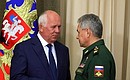 Rostec CEO Sergei Chemezov (left) and Acting Defence Minister Sergei Shoigu before the meeting with Defence Ministry leadership and defence industry heads.