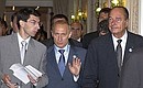 President Putin with French President Jacques Chirac (right) before a G8 working luncheon.