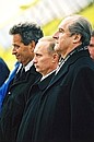 President Putin with Austrian President Thomas Klestil (right) and Tyrol provincial governor Wendelin Weingartner during an airport welcome ceremony.