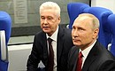 With Moscow Mayor Sergei Sobyanin aboard the Lastochka electric train on the Moscow Central Ring railway.