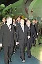 Visiting the Khrunichev State Research and Production Space Centre. President Putin with Director-General of the Khrunichev Centre Alexander Medvedev (left) and presidential aide Yevgeny Shaposhnikov in one of the centre\'s workshops.