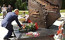 President Putin laying flowers at a monument to the sailors who died aboard the Kursk nuclear-powered submarine.