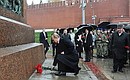 Laying flowers at the monument to Kuzma Minin and Dmitry Pozharsky on Red Square.