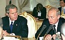 President Putin with US President George Bush at a meeting with businessmen.