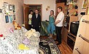 Visiting Lieutenant Colonel Alexander Savichev and his family in their new apartment.