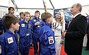 M. GROMOV FLIGHT RESEARCH INSTITUTE, ZHUKOVSKY AIR BASE, MOSCOW REGION. 8th International Aviation and Space Salon MAKS-2007. At the children\'s stand with an exhibition of model airplanes made by children. F2 festival director Viktoriia Soboleva giving explanations.
