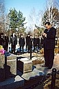 Japanese Prime Minister Yoshiro Mori at the grave of his father.