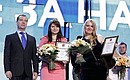 At youth forum The Future is Ours. Dmitry Medvedev presents a Presidential letter of gratitude “For pro-active attitude and public work for the benefit of Russia” to Yekaterina Rogalyova and Alina Pavlyukova.