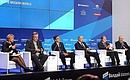 At the meeting of the Valdai International Discussion Club. Left to right: Editor-in-Chief of RIA Novosti Svetlana Mironyuk, former German defence minister Volker Ruehe, former French prime minister Francois Fillon, Vladimir Putin, former Italian prime minister Romano Prodi, and President of the US Centre for the National Interest Dimitri Simes.