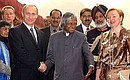 President Putin and his wife, Lyudmila, with Indian President Abdul Kalam, centre, during the welcome ceremony.
