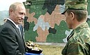 President Putin receiving a gift of a souvenir replica of the T-90 tank at the Peschanka firing range of the 212th Training Centre, the Siberian Military District.