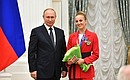 The ceremony for presenting state awards to the winners of the XXXII Olympics in Tokyo. Champion of the XXXII Olympics in the synchronised swimming team event Maria Shurochkina is presented with the Order of Honour. Photo: RIA Novosti