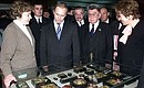 Acting President Vladimir Putin visiting an exhibition featuring products of the Ivanovo Region\'s textile and light industry.