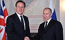 With Prime Minister of the United Kingdom David Cameron.