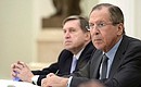 Aide to the President Yury Ushakov (left) and Russian Foreign Minister Sergei Lavrov at a meeting with Chinese Foreign Minister Wang Yi.