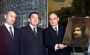 President Vladimir Putin and German Chancellor Gerhard Schroeder visiting the Tsarskoye Selo estate-museum and the Catherine Palace. Schroeder accepting a painting by 17th-century German artist Christoph Paudiss.