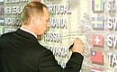 President Vladimir Putin making an inscription on the World Trade Centre Memorial Wall, on the site of the 9/11 terrorist attack.