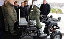 During his visit to the Central Scientific Research Institute of Precise Mechanical Engineering, the President was shown a combat robot.