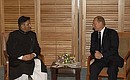 President Putin in conversation with Pakistani President Pervez Musharraf.