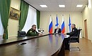During a videoconference with the heads of the central Nakhimov Academy in St Petersburg and the branch in Sevastopol. With Defence Minister Sergei Shoigu (left) and Head of the Nakhimov Academy branch in Vladivostok Vladimir Burakov.