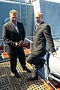 President Putin with Polish President Alexander Kwasniewski on board the missile cruiser Marshal Ustinov. 