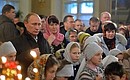 Vladimir Putin attends Christmas mass at the Church of the Intercession of the Holy Virgin in the village of Turginovo in Tver Region.