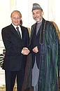 President Vladimir Putin and head of Afghanistan\'s Interim Government Hamid Karzai.