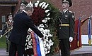 President Putin laying a wreath at the Tomb of the Unknown Soldier.