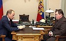 President Putin at a meeting with Prosecutor-General Vladimir Ustinov.