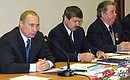 President Vladimir Putin with Yury Neyelov, Governor of the Yamal-Nenets Autonomous Region, in the centre, and Gazprom Board Chairman Rem Vyakhirev during a meeting on the development of the gas industry.