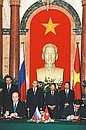 A signing ceremony for Russian-Vietnamese agreements. Russian Foreign Minister Igor Ivanov signing some agreements.