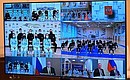 Participants in the meeting with members of Russia’s Olympic team (via videoconference).
