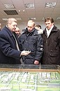 President Vladimir Putin examining a model of the Zapolyarnoye gas field with Gazprom Chairman Alexei Miller, to the right, and Alexander Ananenkov, Yamburggazdobycha CEO.