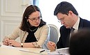 Presidential Aide Elvira Nabiullina and Energy Minister Alexander Novak at a meeting on improving the quality of housing and utilities services.