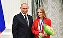 The ceremony for presenting state awards to the winners of the XXXII Olympics in Tokyo. Champion of the XXXII Olympics in the synchronised swimming team event Vlada Chigireva is presented with the Order of Honour. Photo: RIA Novosti