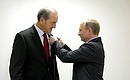 Vladimir Putin presented the Order of Friendship to the President of the International University Sports Federation, member of the International Olympic Committee Claude-Louis Gallien.