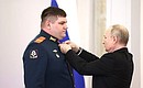 Presentation of Gold Star medals to Heroes of Russia. With Sergeant Yury Mizerny. Photo: Valery Sharifulin, TASS